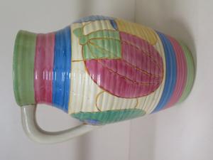 A Clarice Cliff Pastel Melon Fantasque Bizarre single handle Lotus vase in our 20th November auction